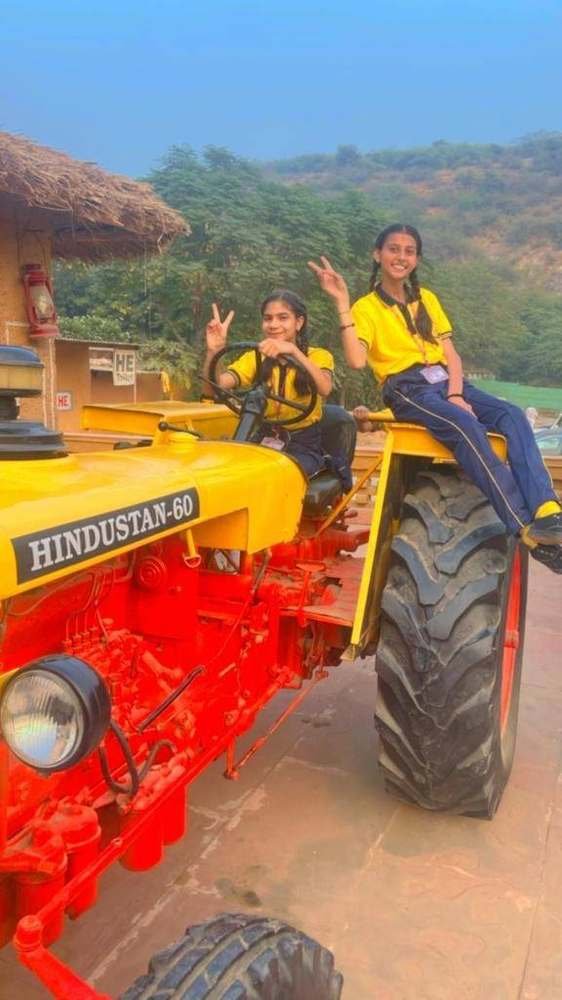 Student enjoying a tractor ride during the school excursion